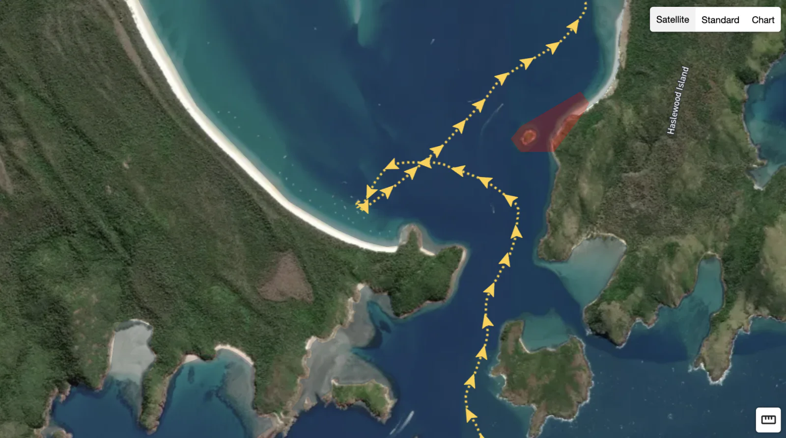 Satellite map view showing a vessel's tracked route and a geofenced restricted zone